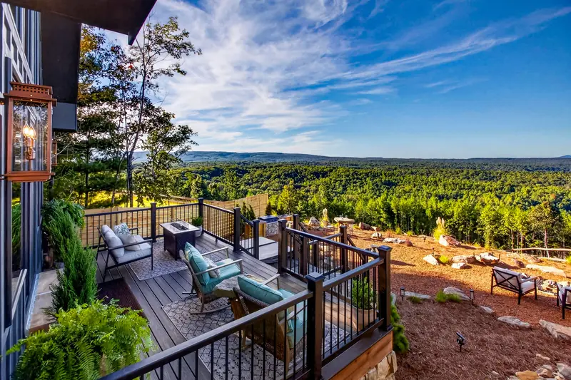Lounge seating on the deck overlooking miles of forest and mountains